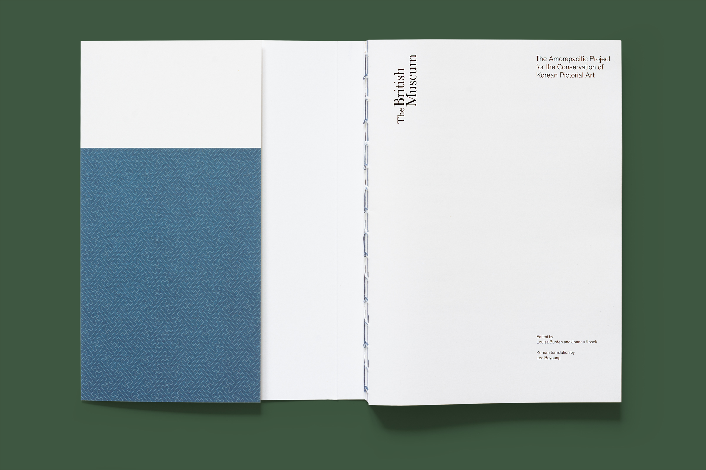 Top-down photo of the inside front cover and title page